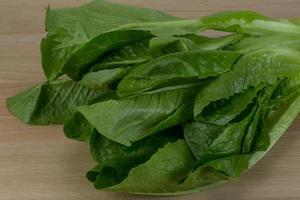 romano salade Aan hout foto