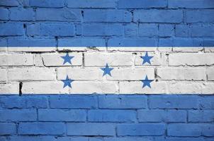 Honduras vlag is geschilderd op een oud steen muur foto