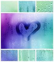 een collage van veel verschillend fragmenten van glas, versierd met regen druppels van de condensaat en geschilderd hart in centrum foto