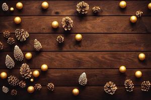 3d illustratie van gouden Kerstmis bollen en pijnboom kegels Aan houten achtergrond foto
