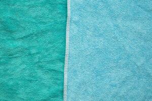 groen en blauw handdoek kleding stof structuur oppervlakte dichtbij omhoog achtergrond foto