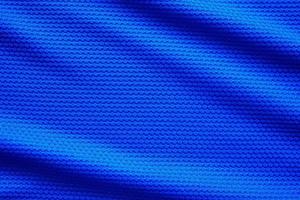 blauw Amerikaans voetbal Jersey kleding kleding stof structuur sport- slijtage achtergrond, dichtbij omhoog top visie foto