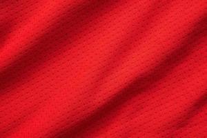 rood sport- kleding kleding stof Amerikaans voetbal overhemd Jersey structuur dichtbij omhoog foto