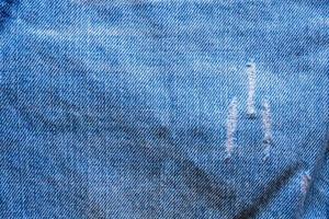 denim blauw jeans gescheurd mode ontwerp structuur dichtbij omhoog achtergrond top visie foto