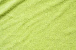 groen handdoek kleding stof structuur oppervlakte dichtbij omhoog achtergrond foto