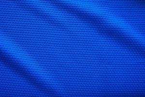 blauw Amerikaans voetbal Jersey kleding kleding stof structuur sport- slijtage achtergrond, dichtbij omhoog top visie foto