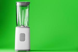 een wit blender met een leeg glas Aan een groen achtergrond. foto