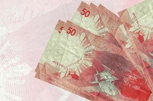50 Filipijns piso rekeningen leugens in stack Aan achtergrond van groot semi-transparant bankbiljet. abstract presentatie van nationaal valuta foto
