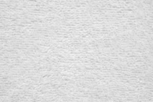 wit pluizig handdoek kleding stof zacht structuur achtergrond foto