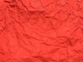 rood verfrommeld papier structuur achtergrond voor ontwerp. behang voor kopiëren ruimte foto