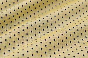 geel sport Jersey kleding kleding stof structuur en achtergrond met veel vouwen foto