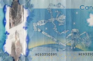 dextre en canadarm2 Aan Canada 5 dollars 2013 polymeer bankbiljet fragment foto