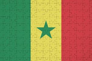 Senegal vlag is afgebeeld Aan een gevouwen puzzel foto