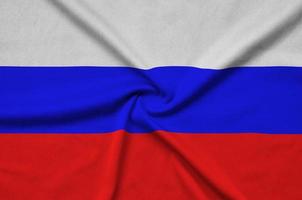 Rusland vlag is afgebeeld Aan een sport- kleding kleding stof met veel vouwen. sport team banier foto