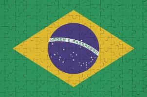 Brazilië vlag is afgebeeld Aan een gevouwen puzzel foto