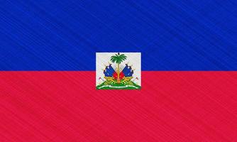 vlag van de republiek van Haïti Aan de kleding stof textuur. foto