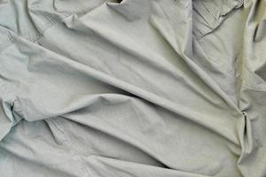de structuur van de kleding stof is olijfkleurig, welke is vergelijkbaar naar de uniform van Amerikaans soldaten van de tweede wereld oorlog foto