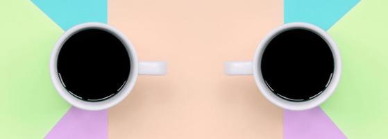 twee klein wit koffie cups Aan structuur achtergrond van mode pastel roze, blauw, koraal en limoen kleuren papier foto