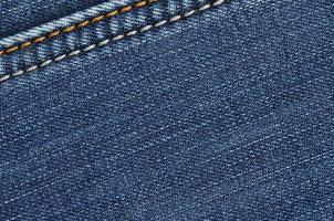 jeans van structuur achtergrond. jeans van structuur wijnoogst achtergrond. detailopname denim van achtergrond en structuur foto