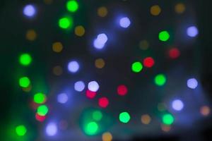 abstracte circulaire bokeh achtergrond van kerstlicht foto