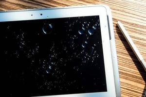 er is water op de tablet gemorst foto