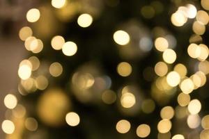 Kerstmis met gouden bokeh lichte achtergrond foto