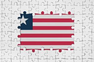 Liberia vlag in kader van wit puzzel stukken met missend centraal een deel foto