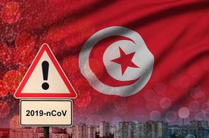 Tunesië vlag en coronavirus 2019-ncov alarm teken. concept van hoog waarschijnlijkheid van roman coronavirus het uitbreken door op reis toeristen foto