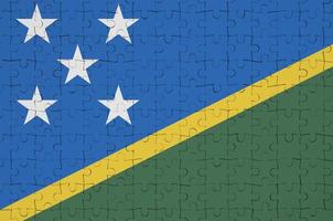 Solomon eilanden vlag is afgebeeld Aan een gevouwen puzzel foto