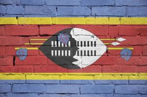 Swaziland vlag is geschilderd op een oud steen muur foto