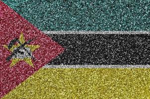 Mozambique vlag afgebeeld Aan veel klein glimmend pailletten. kleurrijk festival achtergrond voor partij foto