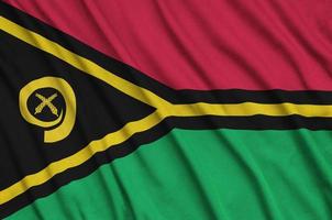 vanuatu vlag is afgebeeld Aan een sport- kleding kleding stof met veel vouwen. sport team banier foto