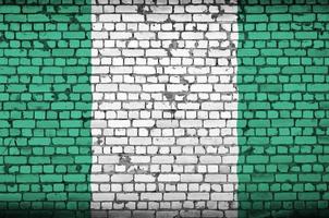 Nigeria vlag is geschilderd op een oud steen muur foto