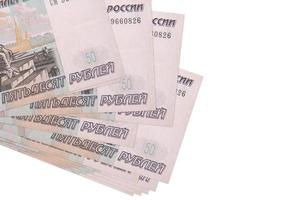 50 Russisch roebel rekeningen leugens in klein bundel of pak geïsoleerd Aan wit. mockup met kopiëren ruimte. bedrijf en valuta uitwisseling foto