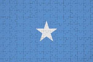 Somalië vlag is afgebeeld Aan een gevouwen puzzel foto