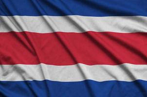 costa rica vlag is afgebeeld Aan een sport- kleding kleding stof met veel vouwen. sport team banier foto