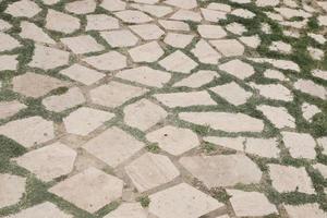 muur achtergrond met geel natuurlijk zandsteen tegels foto