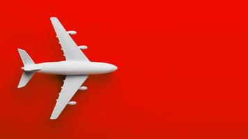 wit passagier model- vliegtuig Aan een helder rood achtergrond. vrij ruimte voor tekst foto