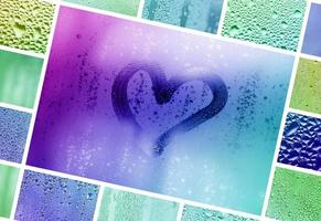 een collage van veel verschillend fragmenten van glas, versierd met regen druppels van de condensaat en geschilderd hart in centrum foto