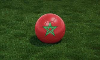 voetbal bal met Marokko vlag kleuren Bij een stadion Aan groen grassen achtergrond. foto