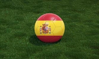 voetbal bal met Spanje vlag kleuren Bij een stadion Aan groen grassen achtergrond. foto