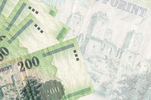 200 Hongaars forint rekeningen leugens in stack Aan achtergrond van groot semi-transparant bankbiljet. abstract bedrijf achtergrond foto