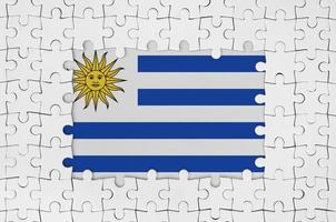 Uruguay vlag in kader van wit puzzel stukken met missend centraal een deel foto