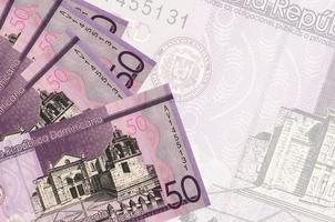50 dominicaans pesos rekeningen leugens in stack Aan achtergrond van groot semi-transparant bankbiljet. abstract bedrijf achtergrond foto