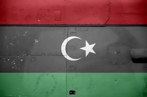 Libië vlag afgebeeld Aan kant een deel van leger gepantserd helikopter detailopname. leger krachten vliegtuig conceptuele achtergrond foto