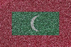 Maldiven vlag afgebeeld Aan veel klein glimmend pailletten. kleurrijk festival achtergrond voor partij foto