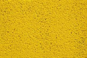 geschilderd geel steen muur voor structuur achtergrond. foto