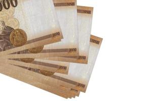 2000 Hongaars forint rekeningen leugens in klein bundel of pak geïsoleerd Aan wit. mockup met kopiëren ruimte. bedrijf en valuta uitwisseling foto