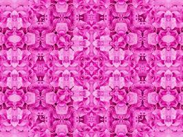 magenta bloemen caleidoscoop patroon. roze bloem abstract uniek en esthetisch achtergrond foto
