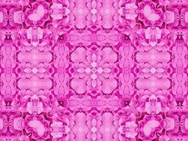 magenta bloemen caleidoscoop patroon. roze bloem abstract uniek en esthetisch achtergrond foto